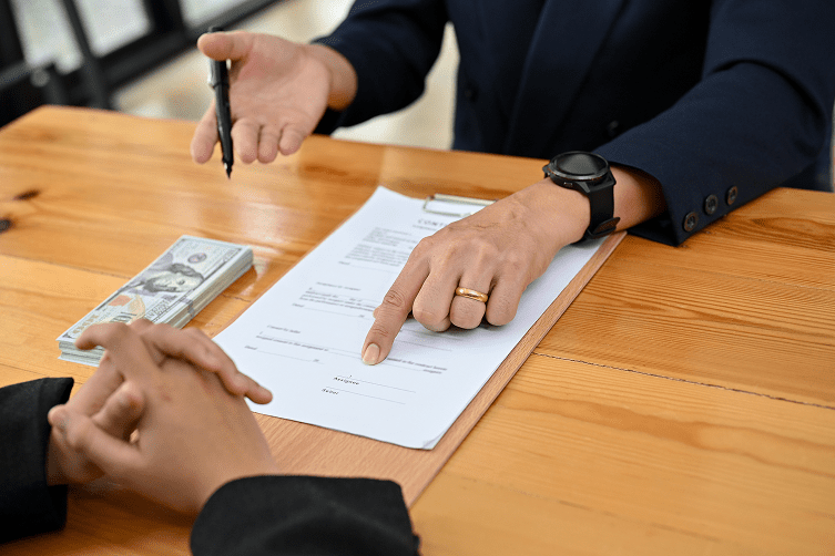 People signing lease document